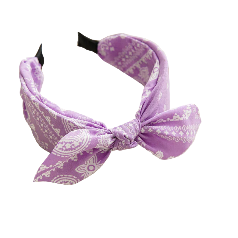 Purple headband with white patterns on a light surface