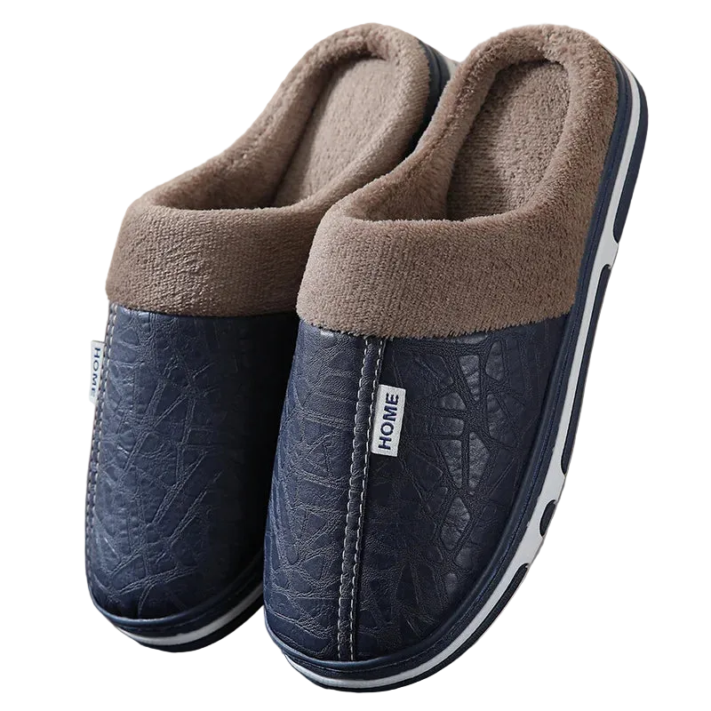Pair of blue slippers with brown fuzzy lining on a neutral background