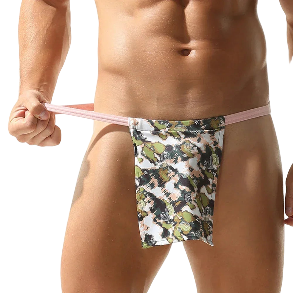 Floral-patterned men's underwear held by a person against a white background