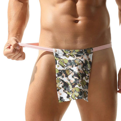 Floral-patterned men's underwear held by a person against a white background