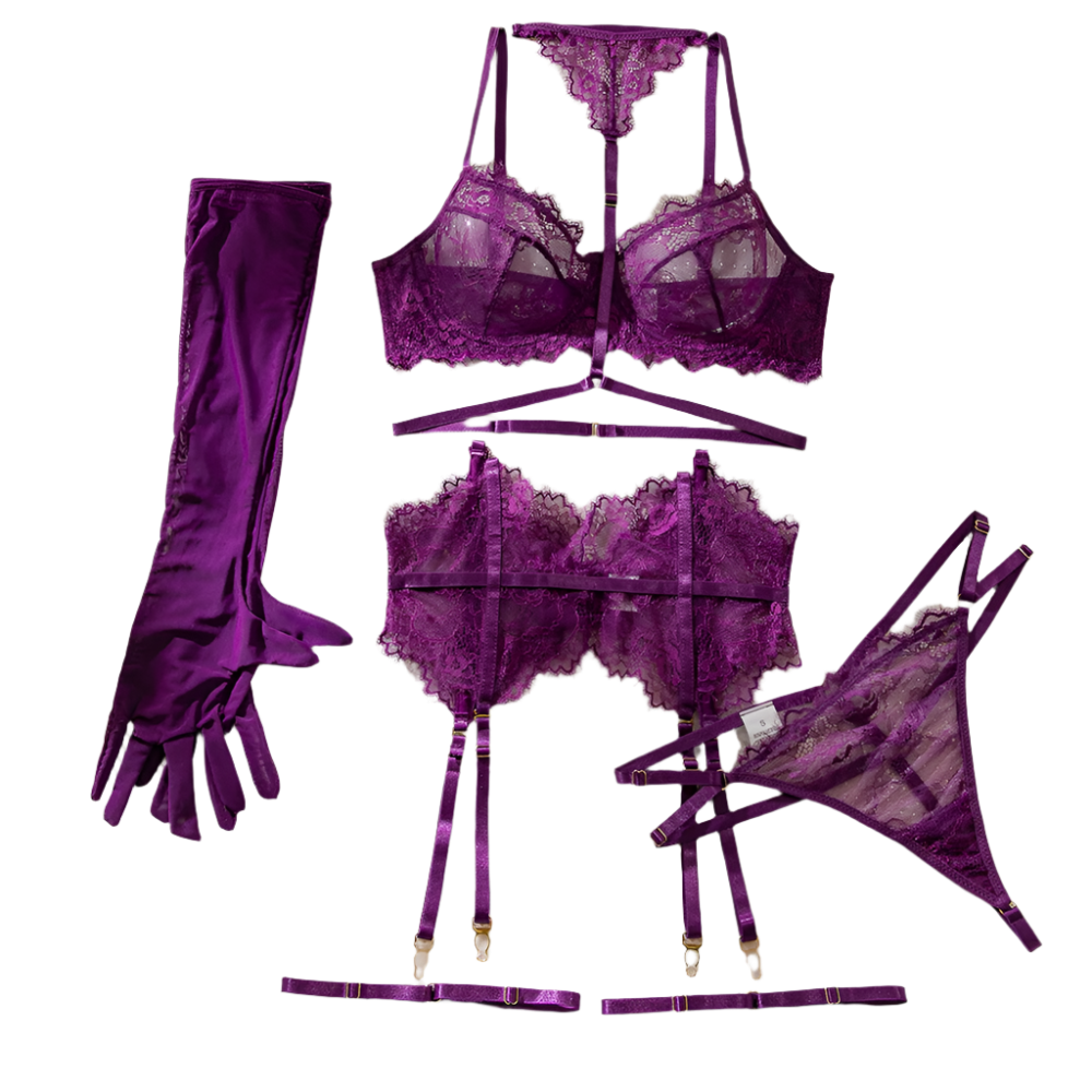 Purple lingerie set with gloves and a book on a white surface