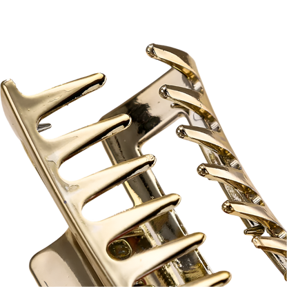 Gold spiral design on a light background