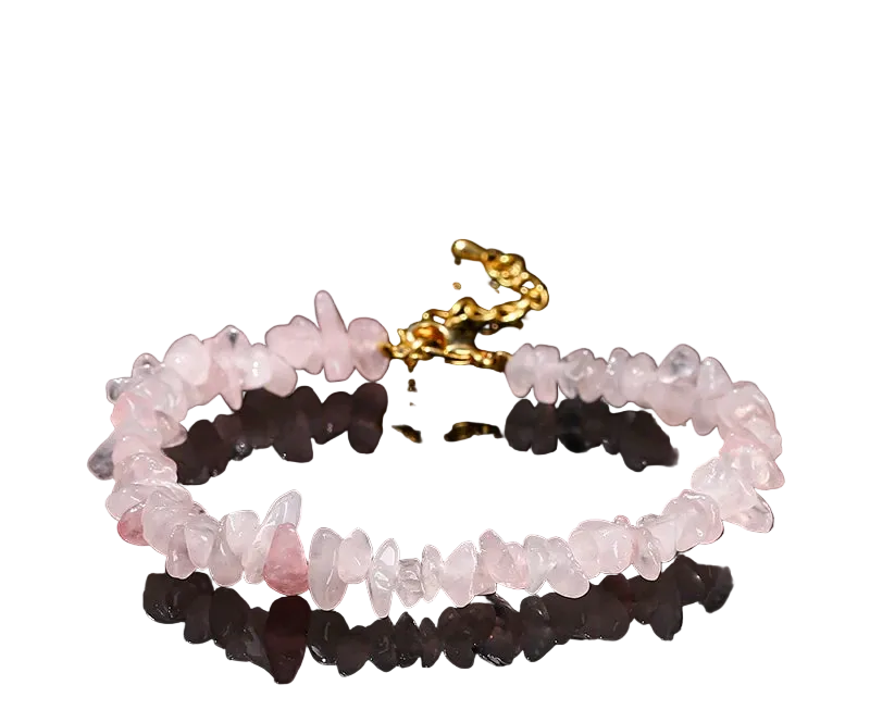 Pink quartz bracelet with gold clasp on a black background