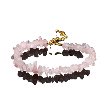 Pink quartz bracelet with gold clasp on a black background
