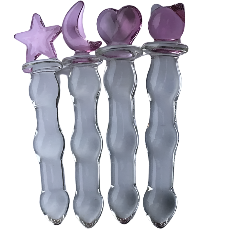 Glass Wand Set: A set of four glass wands with clear bodies and pink decorative tops in shapes of a star, crescent moon, heart, and cat ears.