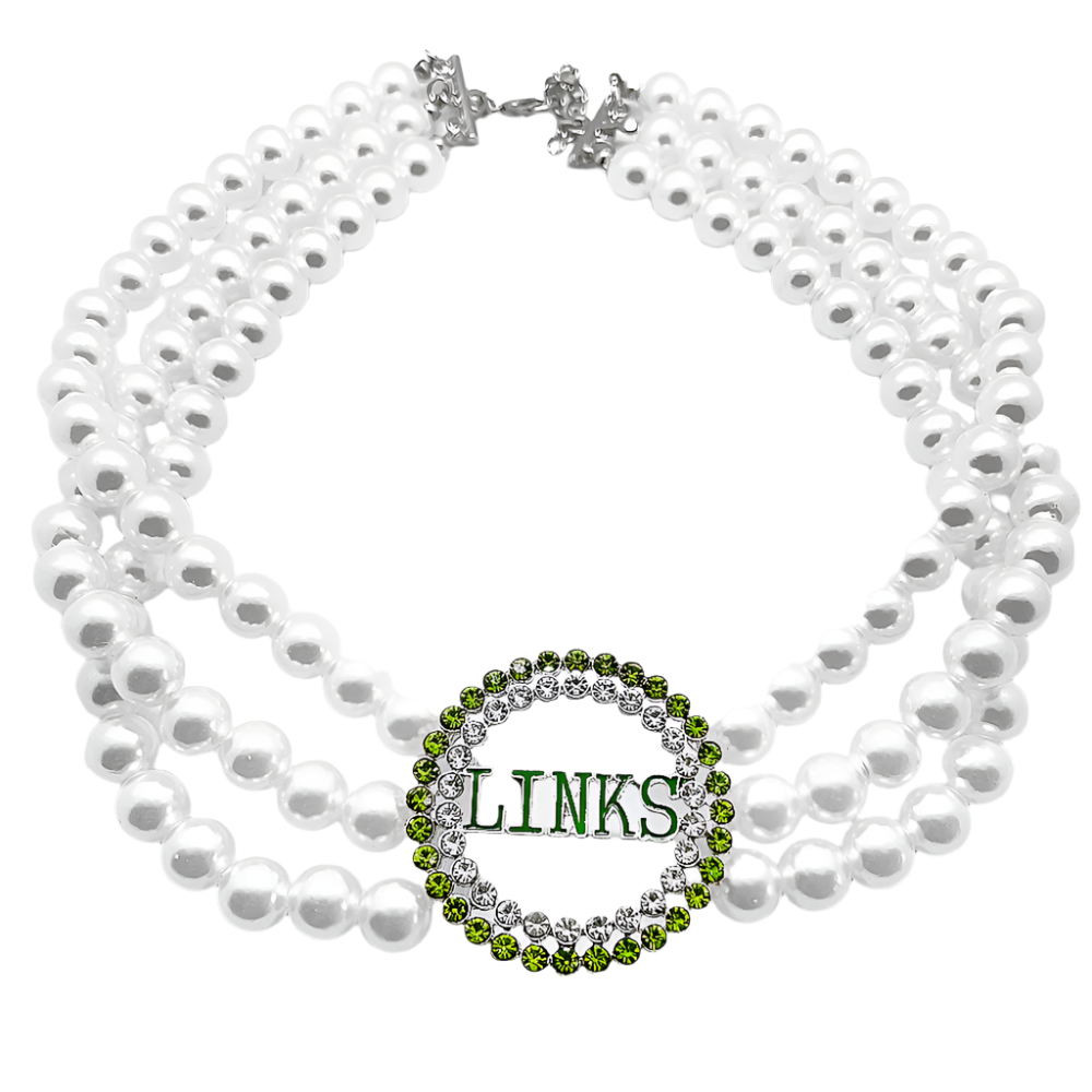 White pearl necklace with a green and silver 'LINKS' pendant on a white background