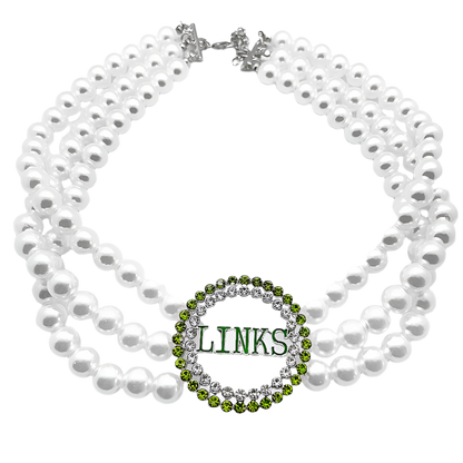 White pearl necklace with a green and silver 'LINKS' pendant on a white background