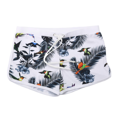 bird and leaf-patterned swim shorts with a white waistband