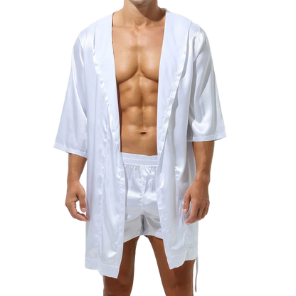 Man wearing a white satin robe and shorts on a white background
