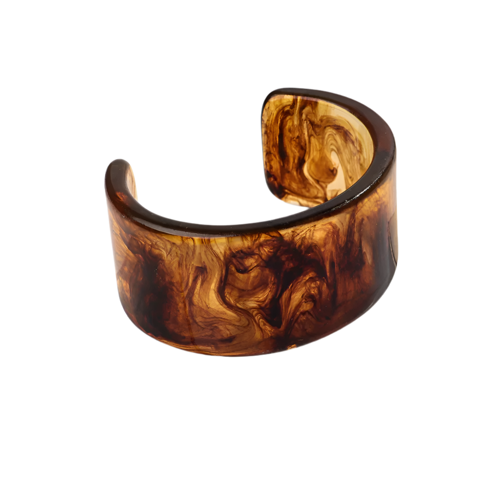 Bold leopard print wide cuff bangle featuring hollow geometric patterns and premium resin design for resort wear and theme nights

