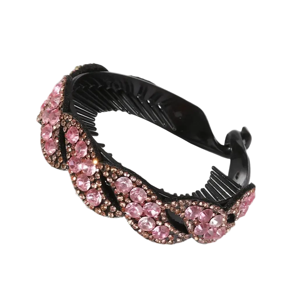 A black hair claw clip embellished with a wavy border of pink rhinestones and rose gold-toned metal settings, shown on a plain white background.