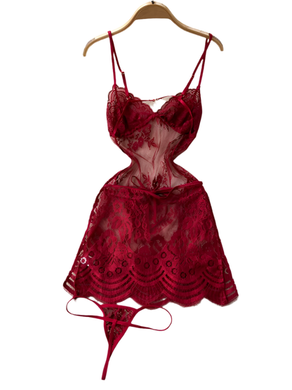 Red lace lingerie set on a hanger against a white fur rug.