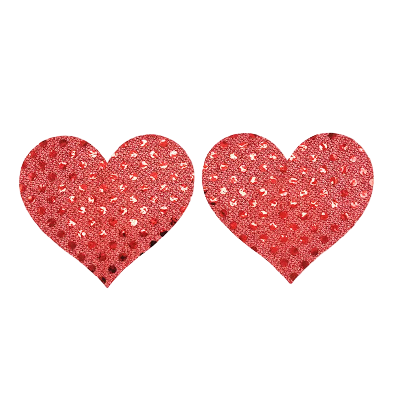 Red glittery heart-shaped pasties on a white background