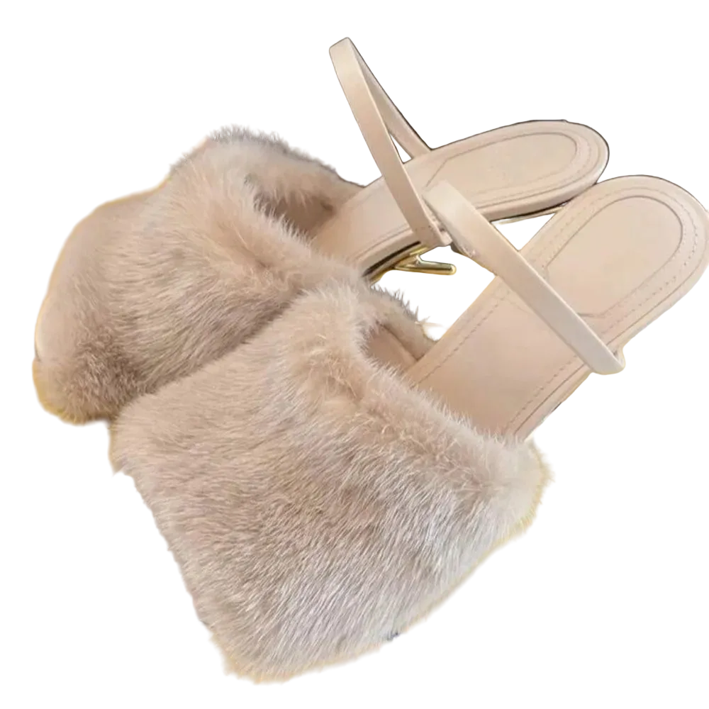 Beige sandals with fluffy fur sole on a yellow surface