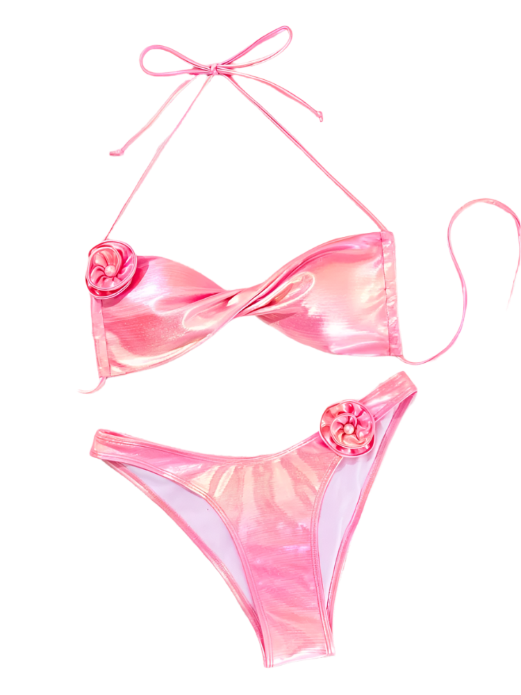 A shiny pink bikini with a wrap-style top and high-waisted bottoms. It includes decorative flower accents on the top and bottom, adding a playful touch.