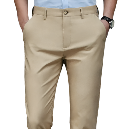 Beige pants worn by a person on a gray background
