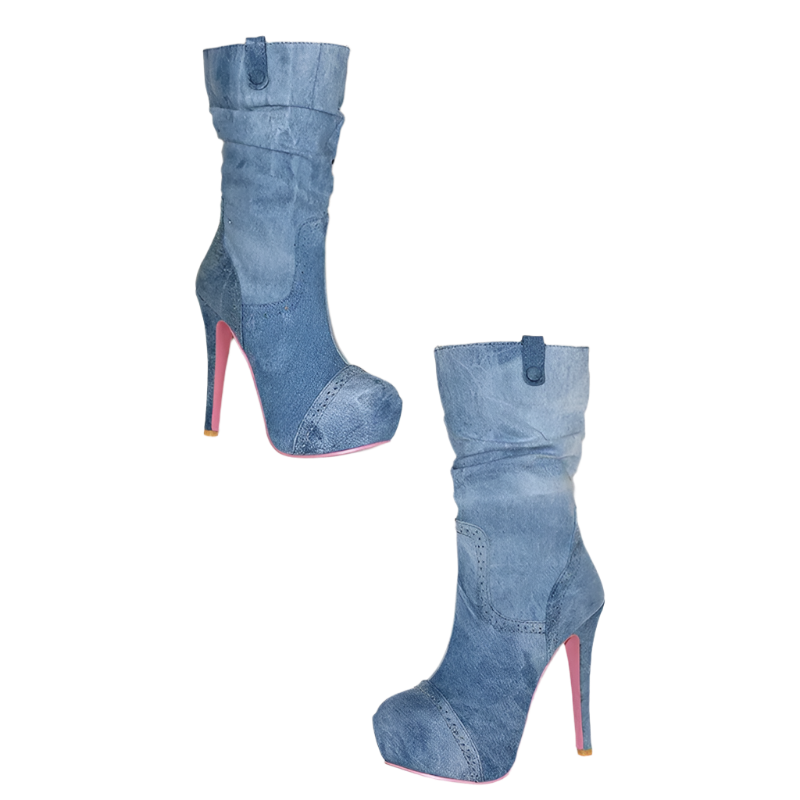Blue denim high-heeled boots with red soles on a white surface.