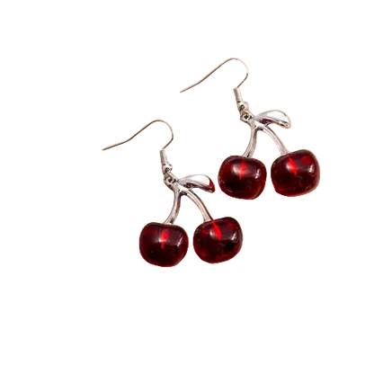 Cherry-themed earrings on a beige jewelry box