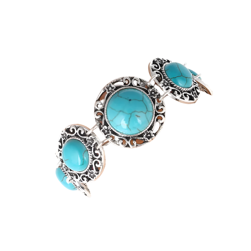 Turquoise stone bracelet on a wrist against a white background