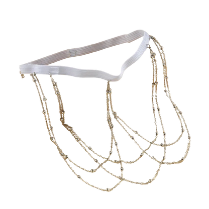 A white elastic waist chain decorated with multiple draped silver beaded chains, displayed on a beige background.