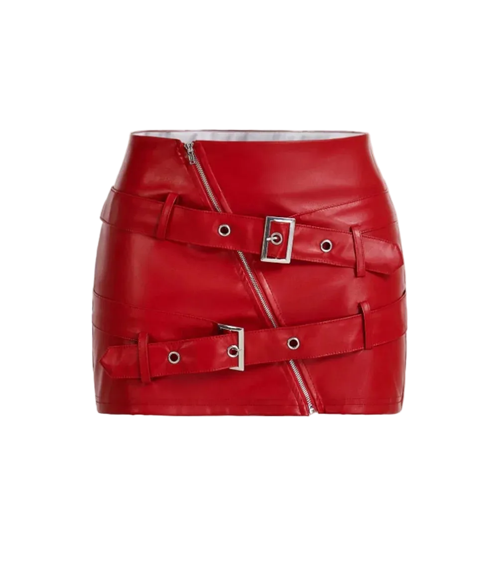 Red leather skirt with silver buckles on a light beige background