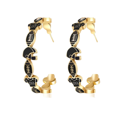 Gold hoop earrings with black engravings on a white background