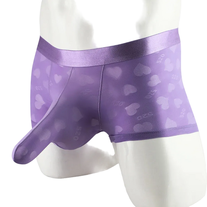 Purple satin heart-patterned underwear on a mannequin against a white background