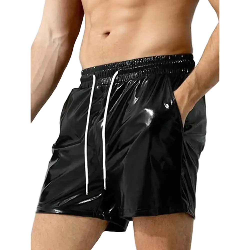 Black shiny vinyl swim trunks with white drawstrings, shown on a male model against a white background.