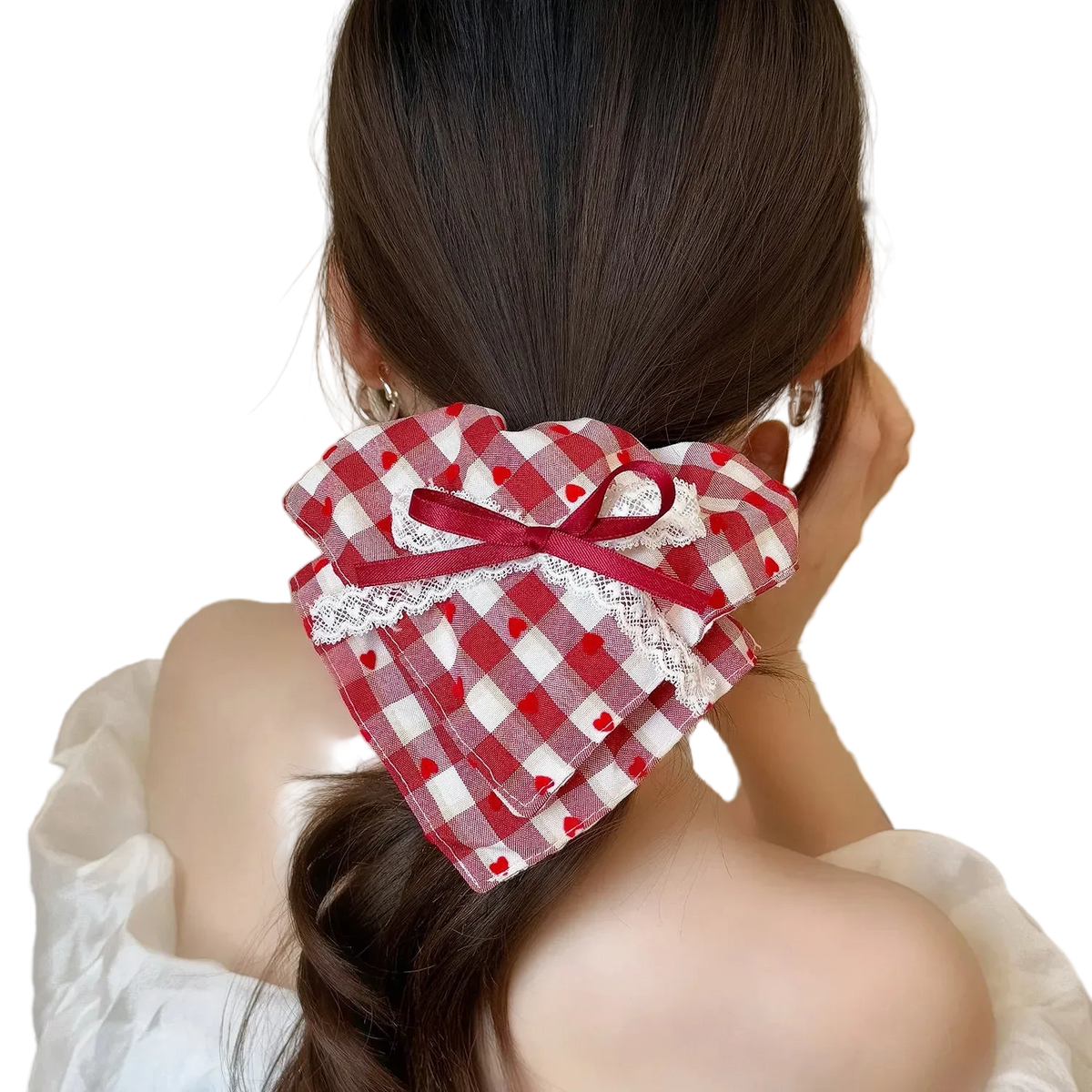 A red and white gingham hair bow accessory with a red ribbon bow and white lace trim, shown tied to a woman's low ponytail from behind.