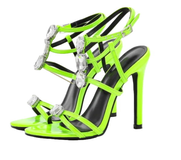 Neon green high-heeled sandals with black straps and crystal embellishments on a white background