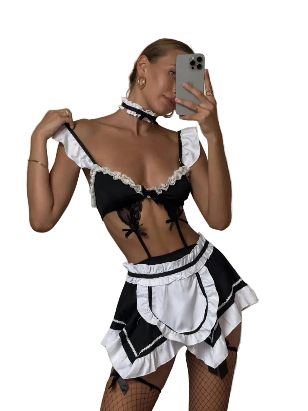 A woman takes a mirror selfie wearing a black and white maid costume set with ruffles, a lace bra top, a mini skirt, and a matching choker. She is holding a silver smartphone in a bedroom setting.