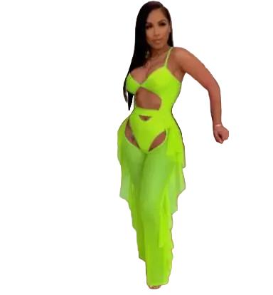 Person wearing a bright green dress with cut-out design in an indoor setting.