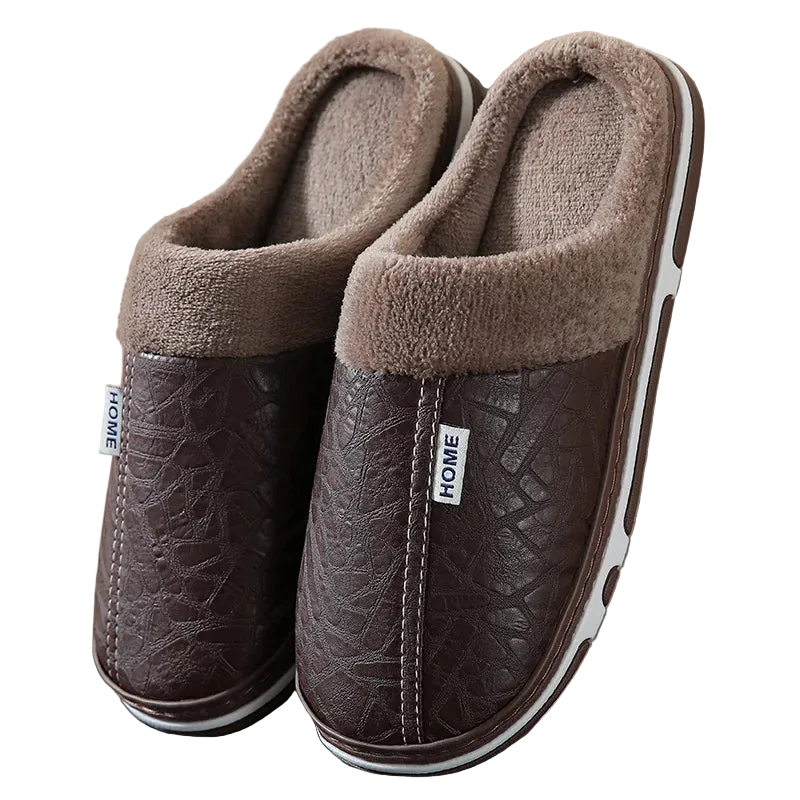 Pair of brown slippers with textured sole and fluffy collar on a neutral background