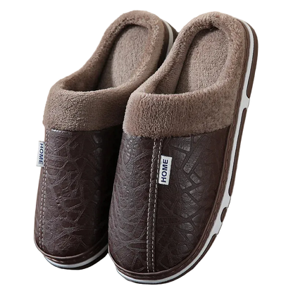 Pair of brown slippers with textured sole and fluffy collar on a neutral background