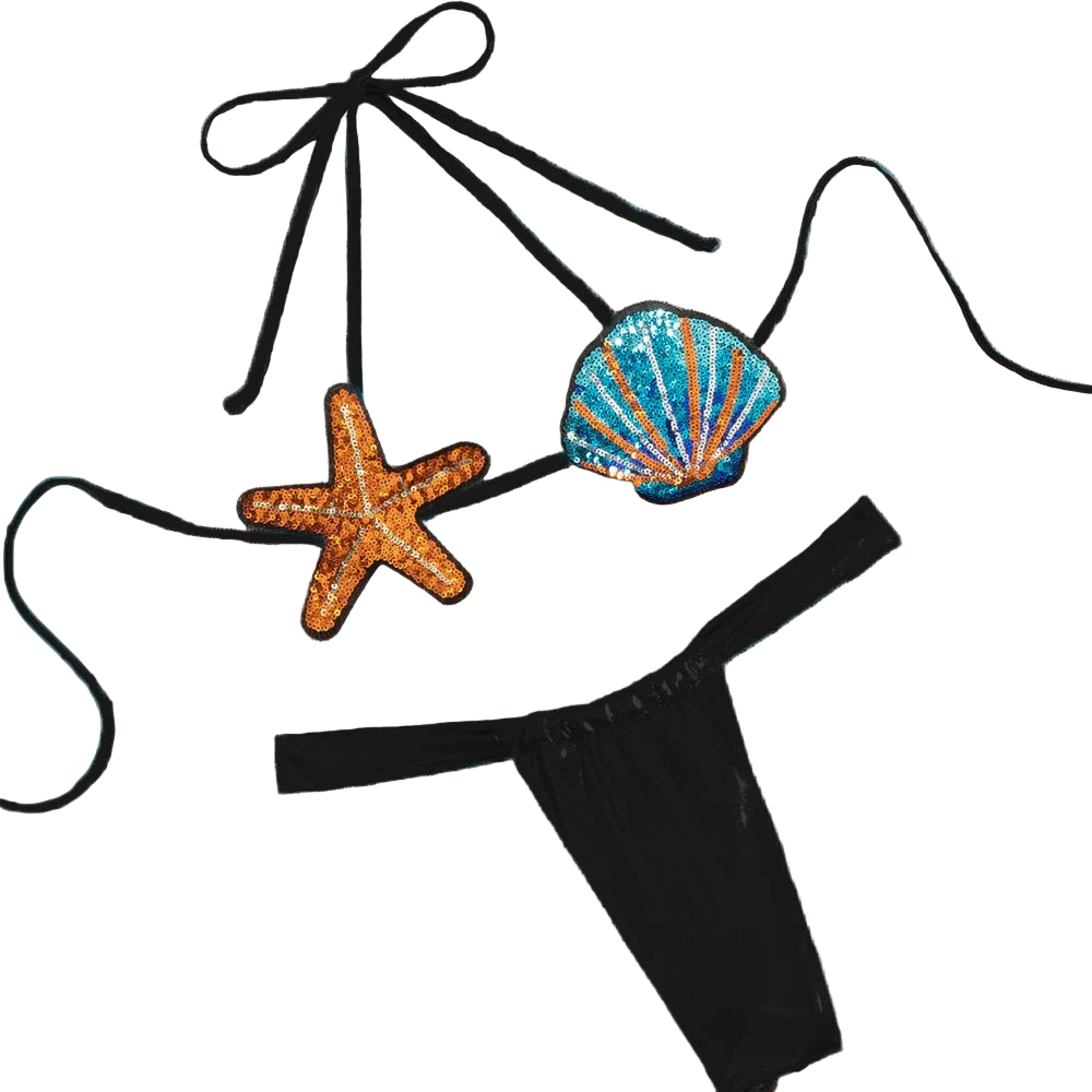 Black bikini with starfish and shell decorations on a beige fabric background