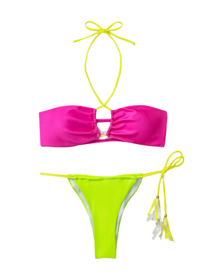 A vibrant bikini with a hot pink top and neon green bottoms. It features a minimal design with string ties, creating a bold and colorful look.