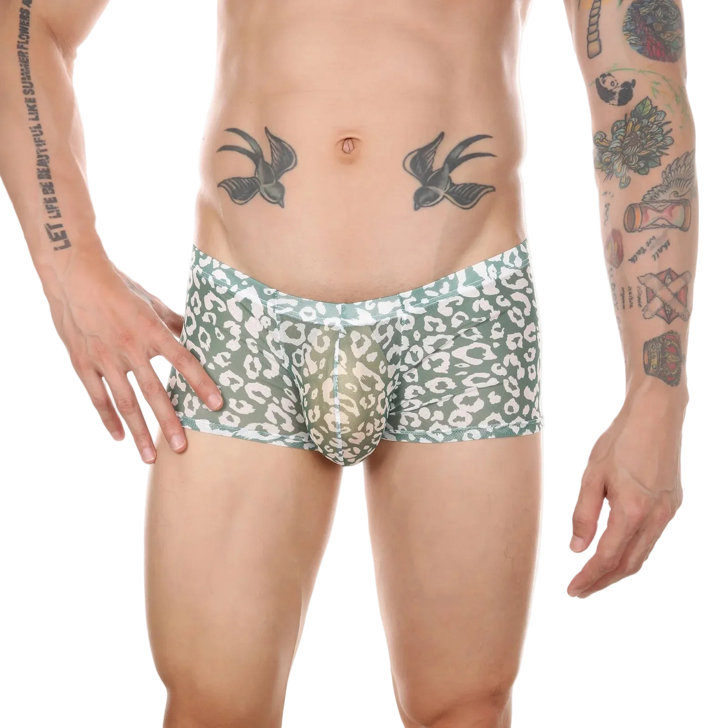 A man's lower torso wearing men's boxer briefs with a sage green and white animal print pattern, shown against a plain white background.