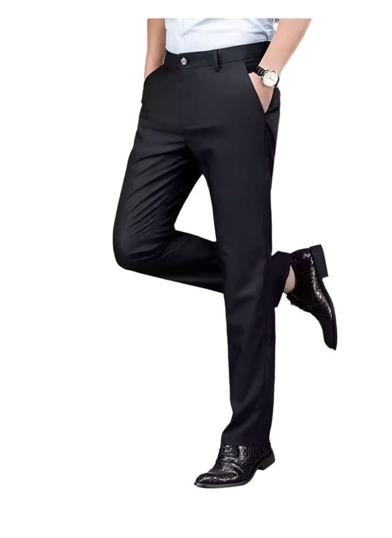 Person wearing black dress pants with a gray background