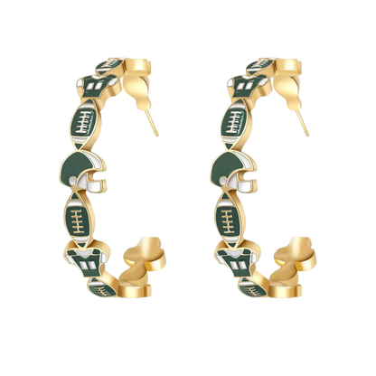 Gold and green earrings on a white background