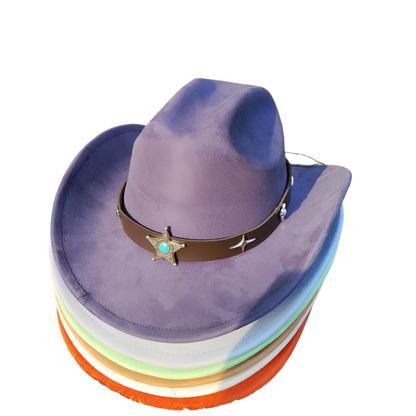 Stack of colorful hats with a purple top hat featuring a star and starfish design on a grassy background.