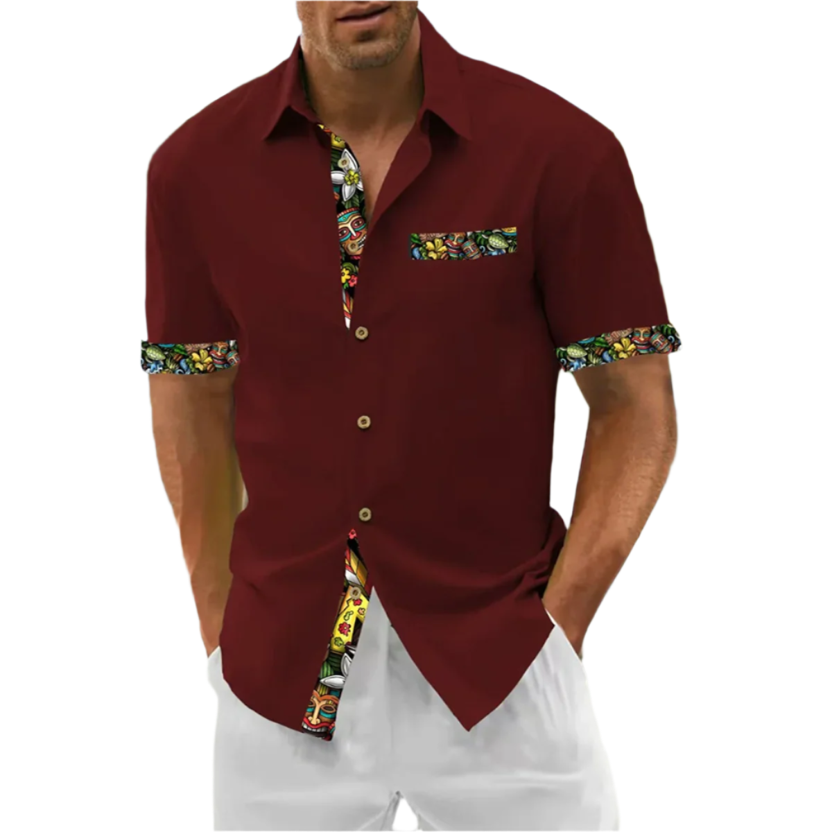 Man wearing a maroon shirt with colorful trim on a beach