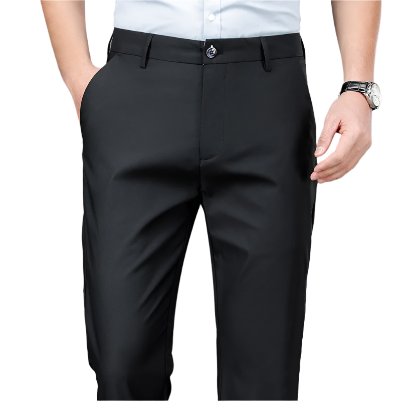 Black dress pants worn by a person on a gray background