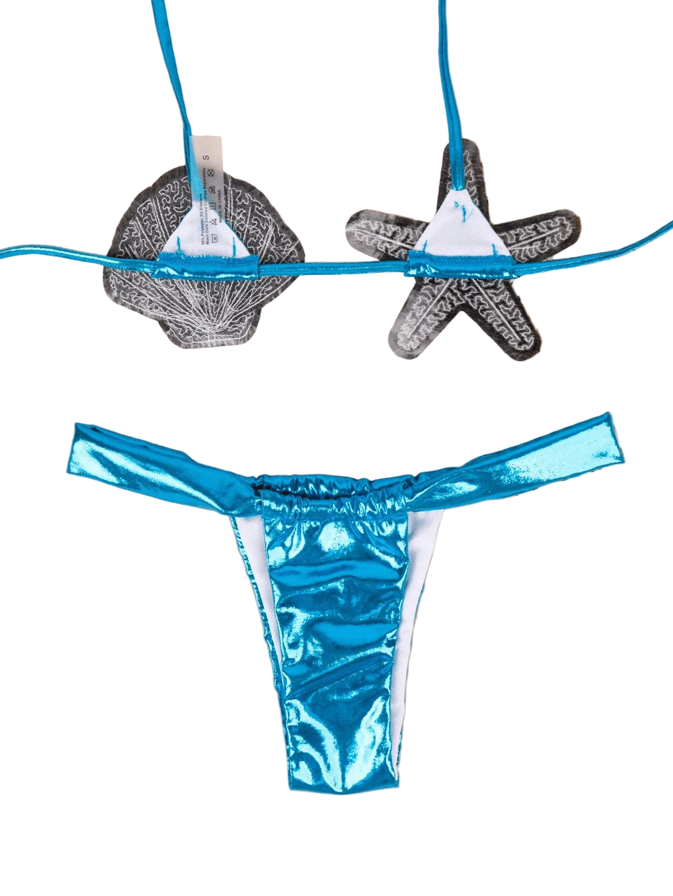 Blue bikini bottom with white accents on a beige surface with starfish and shell decorations.