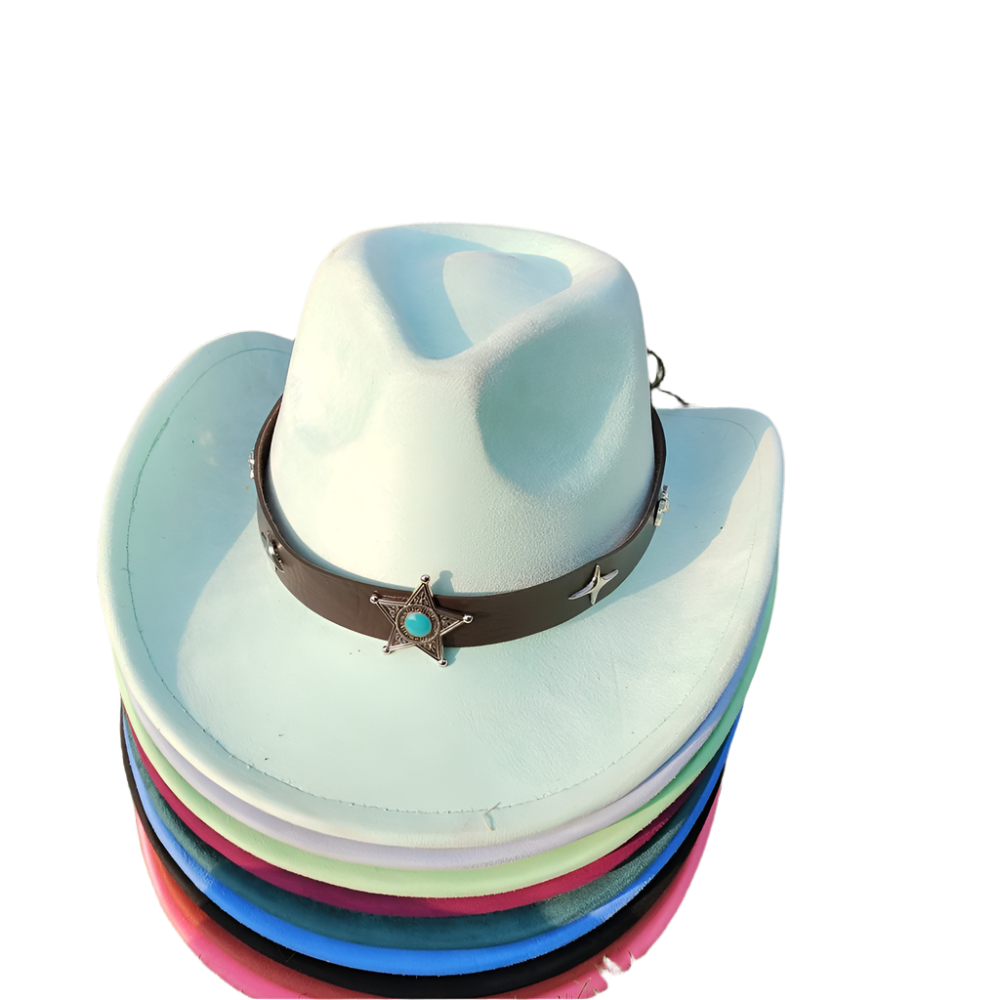 Stack of colorful cowboy hats with a star and turquoise stone on a grassy background