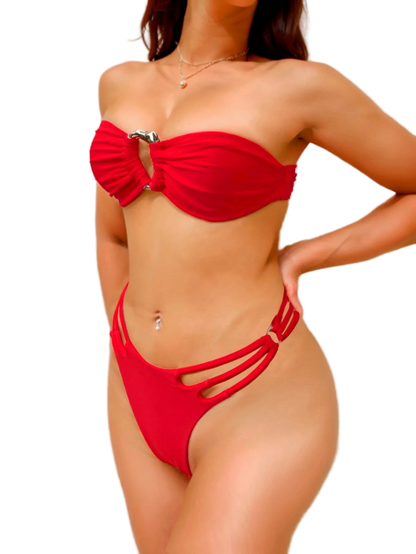 Red bikini worn by a person on a plain background