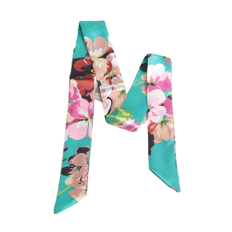 Floral ribbon with turquoise background on a white surface