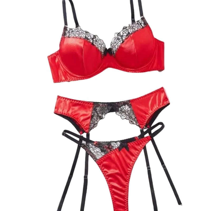 A three-piece red satin lingerie set with black lace trim and black straps, shown on a solid gray background.