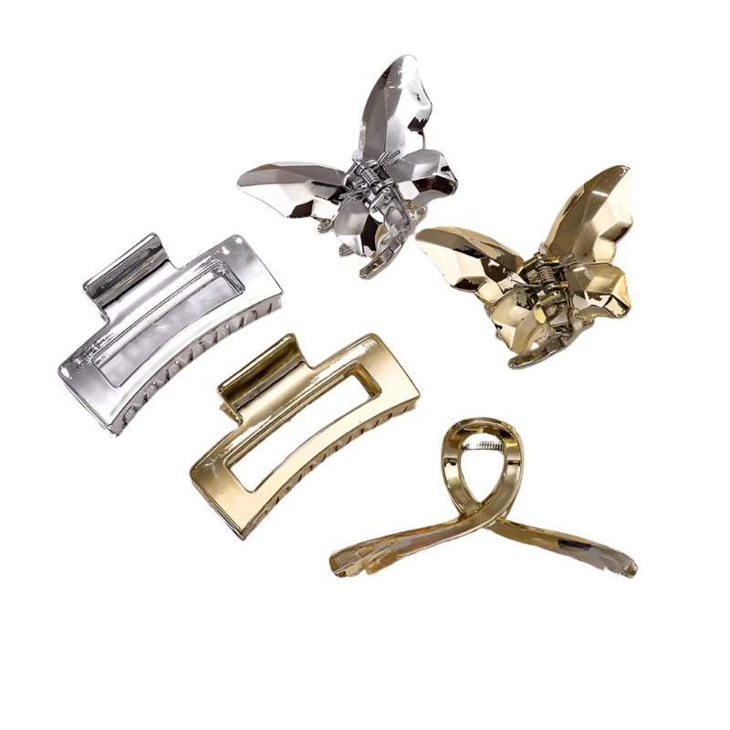 Set of gold and silver hair clips on a white background