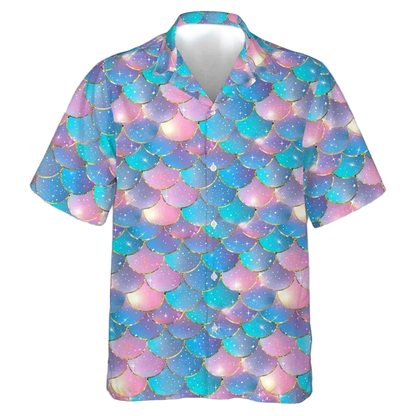 A short-sleeve button-up camp shirt featuring a mermaid scale pattern in pastel pink, purple, and blue with gold outlines and white star details, shown on a white background.