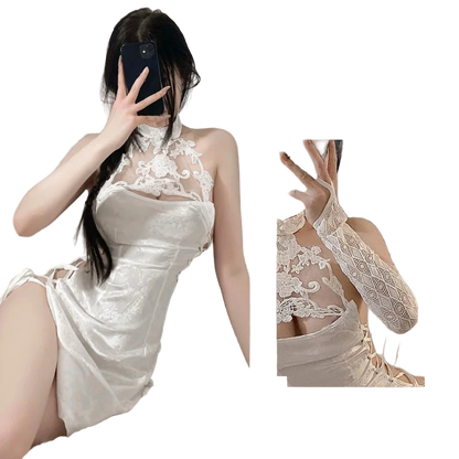 Woman wearing a white lace dress with a close-up inset, set against a neutral background.